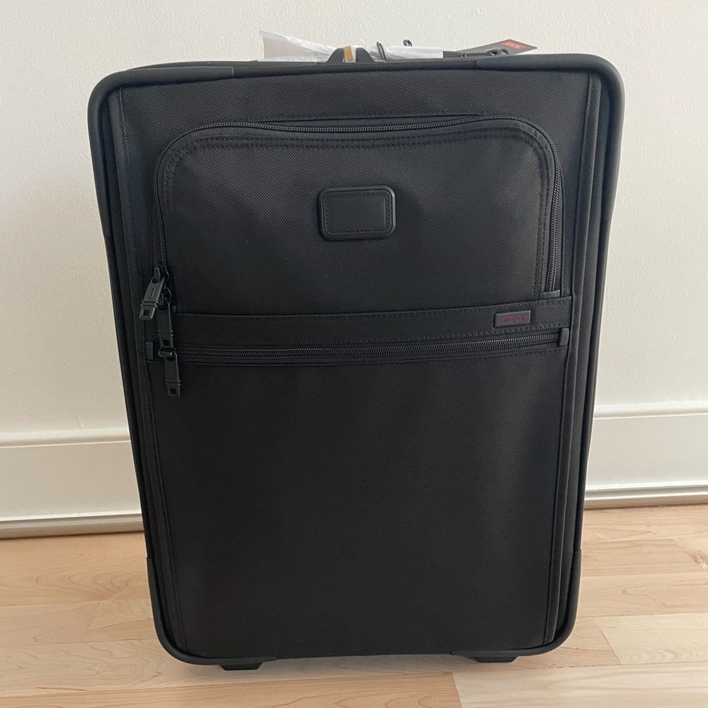 Brand new TUMI 2 wheel carry on! Purchased for $675.  Perfect condition w/ tags
